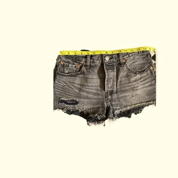 Levi’s 501 mid rise distressed black jean shorts size 28