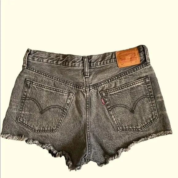 Levi’s 501 mid rise distressed black jean shorts size 28